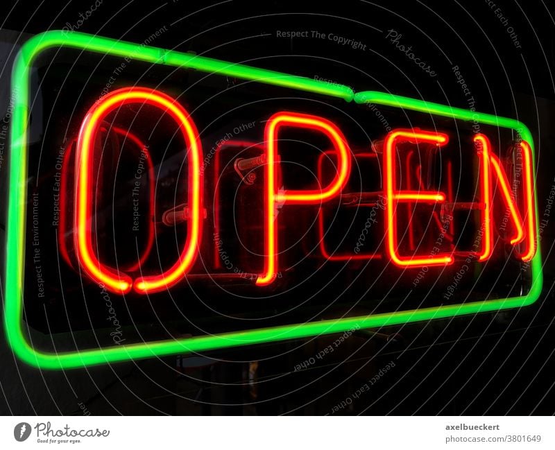 open neon sign in shop window at night red store business illuminated symbol signage retail glowing restaurant dark light lamp bar nightlife entertainment pub