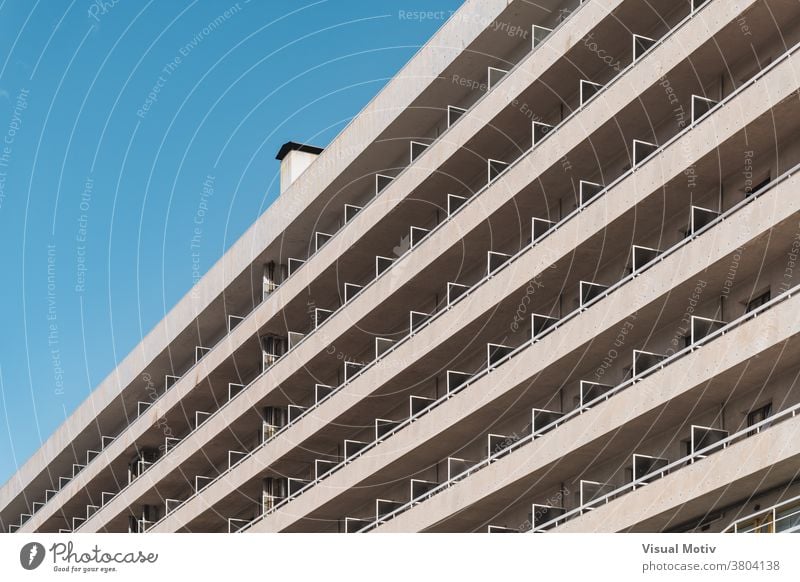 Rows of balconies of an urban contemporary building in diagonal view facade architecture metropolitan edifice structure geometric abstract design modern rows