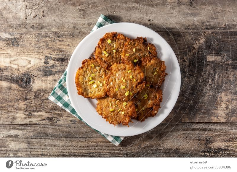 Traditional Jewish latkes or potato pancakes boxties delicious deruny dish egg food fried hanukkah homemade ingredient israel jewish levivot onion plate