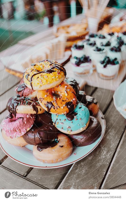 Delicious Donuts cake with chocolate topping. Festive family or party snack concept. Overhead view. donut Cake Topping Yummy Celebration birthday delicious