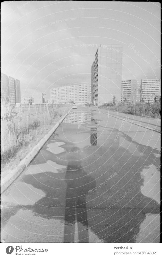 marzipan tooth House (Residential Structure) Construction site Facade Empty Gloomy sad melancholy GDR East Berlin Light Shadow inanimate sign Places Parking lot