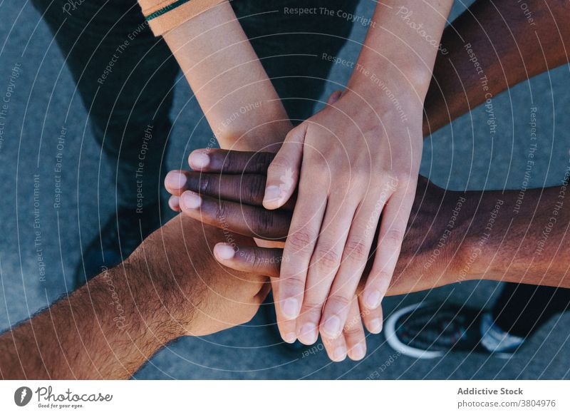 Joyful people stacking hands together couple stack hands positive relationship joy friendship optimist gesture enjoy african american black ethnic curly hair