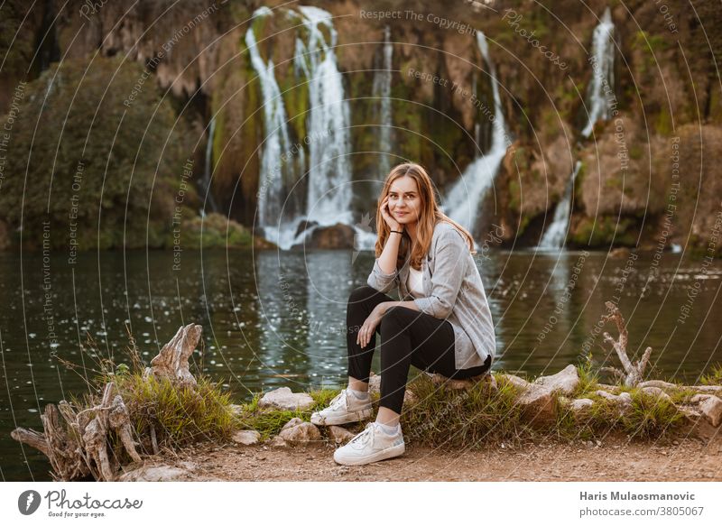 Beautiful blonde woman enjoying the nature near scenic waterfalls attractive balance beautiful beauty enjoy life enjoy nature explore female forest freedom