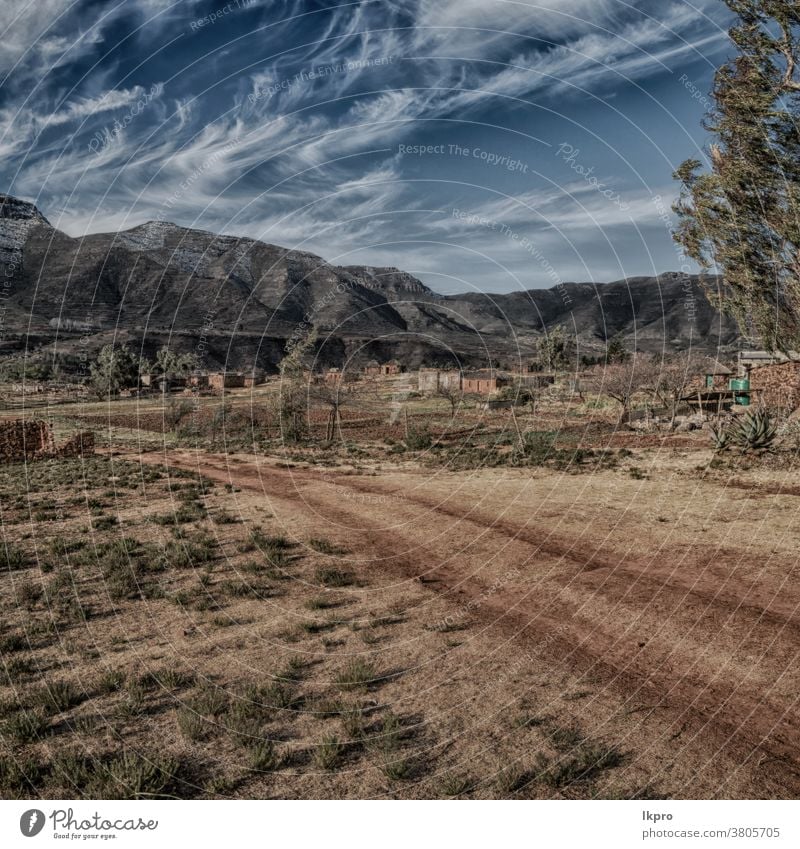 in lesotho  street village near  mountain africa south landscape drakensberg sky pass nature rural green road kingdom travel maluti blue sani african view snow