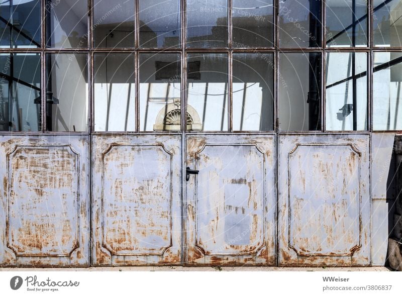 The weathered but often used doors of an old orangery Orangerie Winter garden Goal Window Garden Italy Villa palazzo rear building plant Historic Rome Workshop