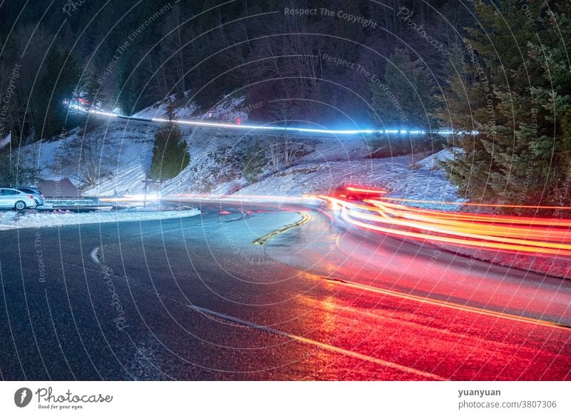 traffic lights at night road speed transportation highway car curve motion mountain travel sky dark landscape street view dusk scene vehicle twilight fast