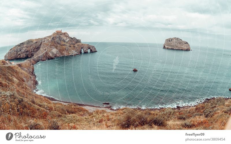 Gaztelugatxe Island in Bilbao, Spain lone rock giant cliff beach nature sharp vizcaya basque country copy space coast travel stone high water view ocean