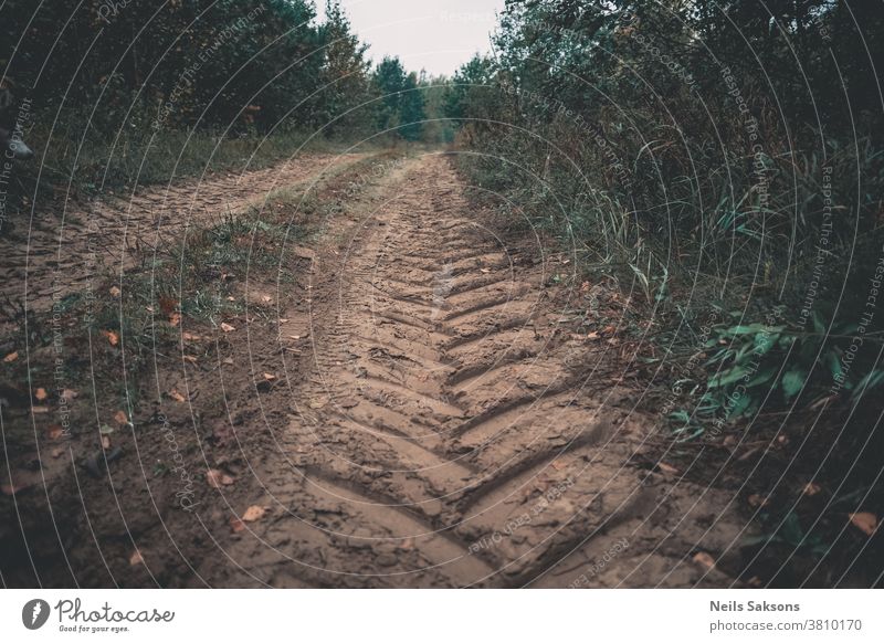 tractor trace on country sand road abstract background car clay gountry desert dirt dirty drive dry dune dust earth imprint land line mark mud muddy off outdoor