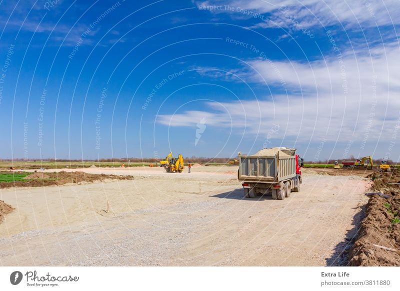 Truck is going, passing over building site Activity Area Base Building Site Business Civil Engineering Construction Drive Dumper Flatten Fraction Gravel Ground