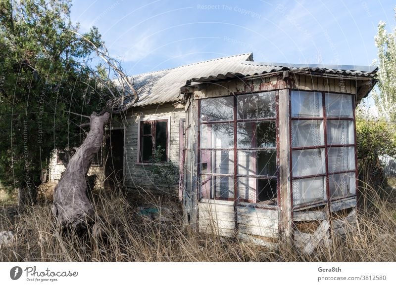 old abandoned wooden village house in Ukraine abandoned house architecture autumn blue building conflict construction country house crisis day derelict desert