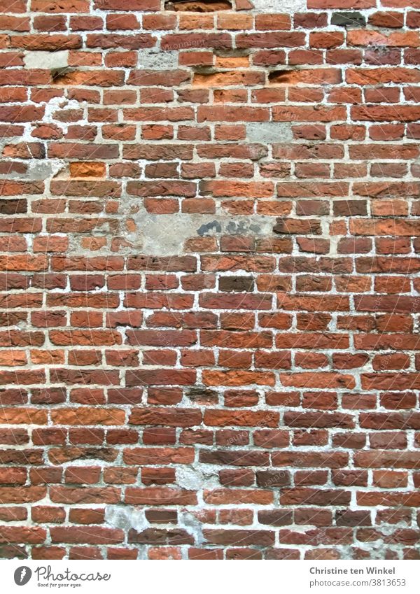 Old red - brown brick facade with repaired areas Brick facade Brick wall Bricks Red Wall (building) Wall (barrier) Facade Stone Structures and shapes Building