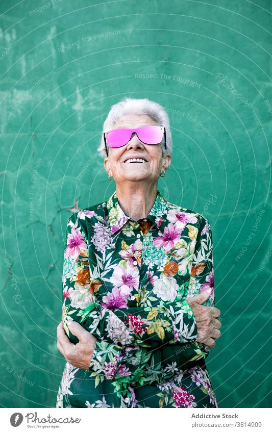 Stylish elderly woman in trendy sunglasses senior style hipster cool colorful outfit female fashion urban lifestyle bright individuality crazy happy cheerful