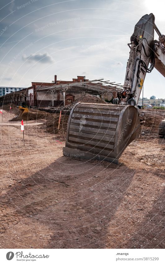 Excavator in the lunch break Construction site Sky Beautiful weather Work and employment Construction vehicle heavy device Excavator shovel Build