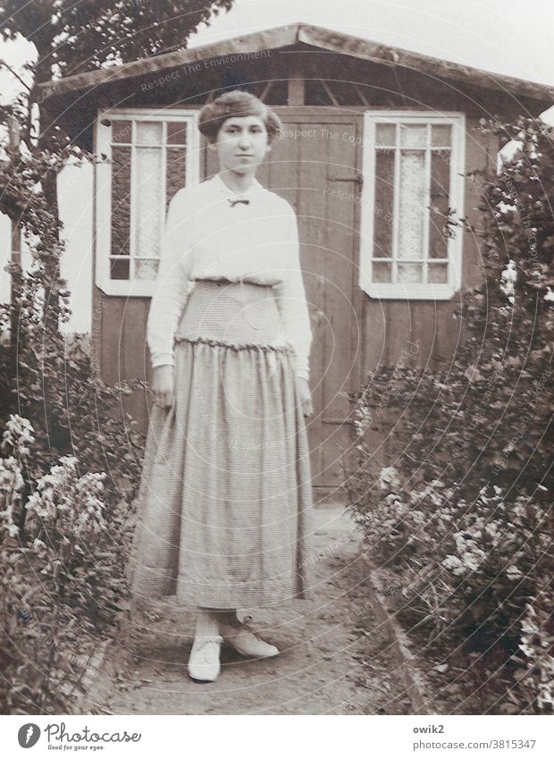 Waiting portrait Former Old fashioned Past Retro pretty Friendliness Stand Looking Smiling Observe Lanes & trails Garden Bushes Looking into the camera