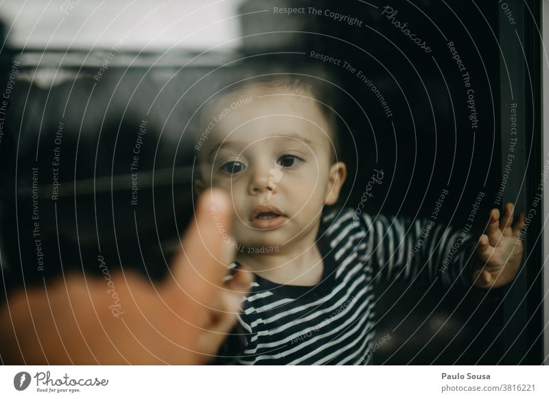 Child playing with father through window through glass Window Authentic Toddler childhood reflection quarantine home isolation Family & Relations Lifestyle Love