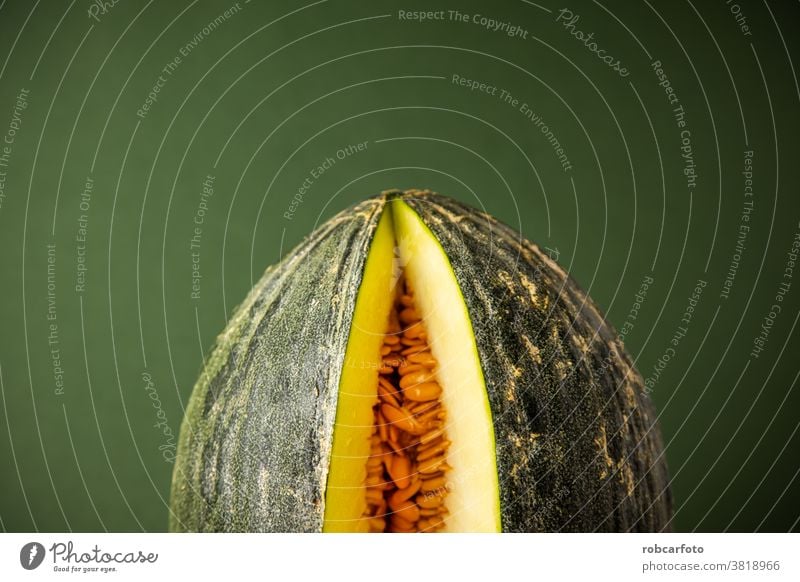 melon open on green background sweet juicy food ripe yellow fruit fresh healthy dessert nutrition delicious organic slice white isolated cut tropical nature