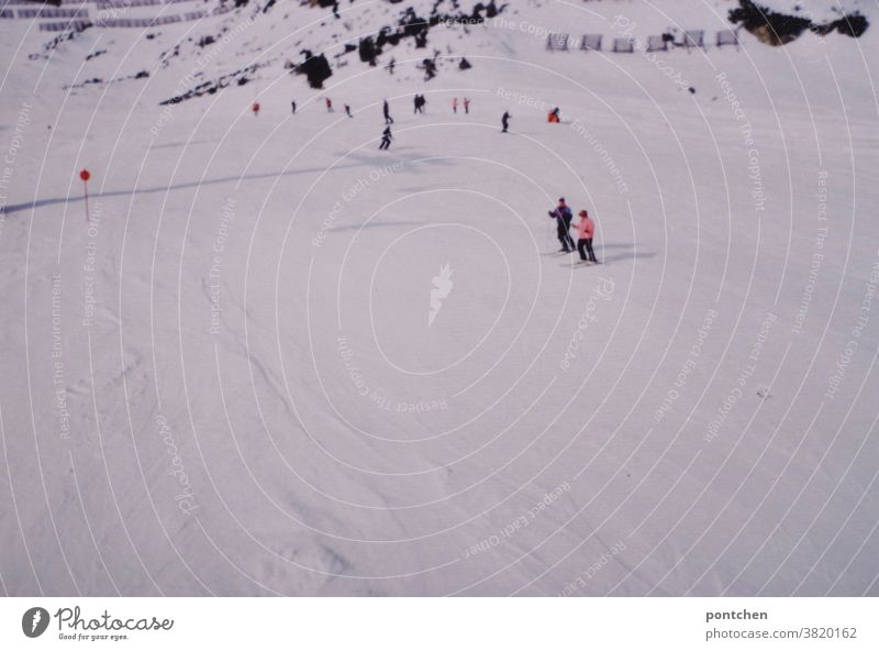 View from the ski lift skier to the ski slope Skiing Ski run skis Winter Winter sports Snow mountains vacation fun Mountain Alps Skis Snowcapped peak people