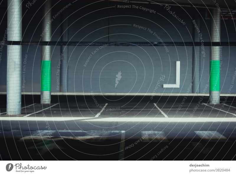 Empty parking bay in the underground car park. With green painting on the columns. Parking garage Architecture Concrete Wall (building) Wall (barrier) Deserted