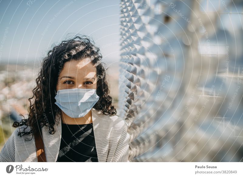 Curly woman with disposable mask Caucasian Woman 30 - 45 years Adults 18 - 30 years Colour photo Young woman Human being Central perspective Beautiful