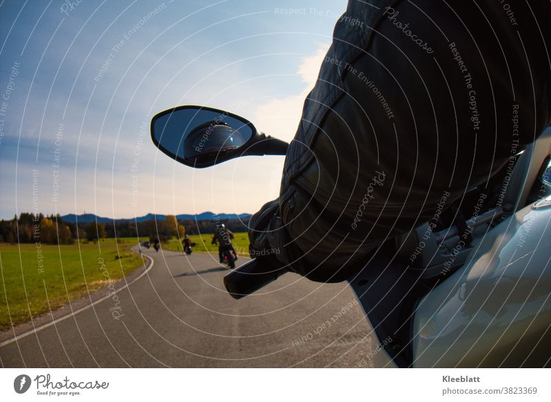 Motorcycle ride from the perspective of a pillion rider into the autumnal mountain landscape with motorcycles in front Motorcycling motorcycle season