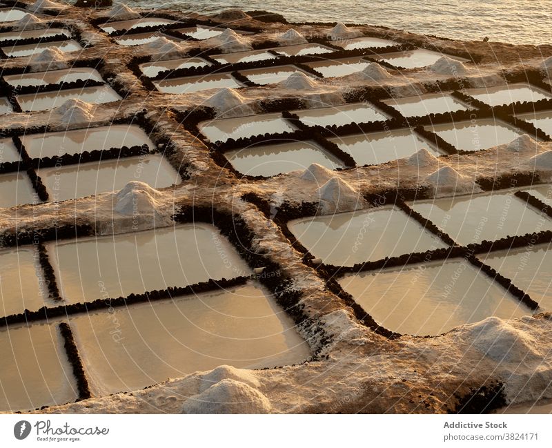 Salt ponds near sea on sunny day salt lake flat scenery salty amazing landmark destination sunset la palma spain fuencaliente tenerife evening twilight