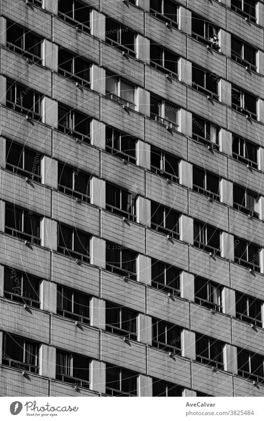 A black and white close up of a symmetrical building architecture pattern texture surface contemporary built structure masonry stone no people modern obsolete