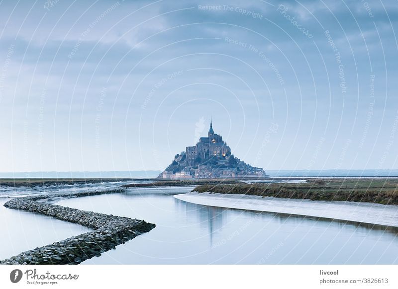 view of mont saint michel at sunset, france sunrise light mount st michael abbey church hill place famous place tourist place cloudy pink sunset lovely nice