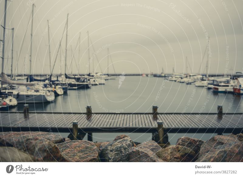 Ships at the harbour behind a jetty in bad weather ships boats Harbour Footbridge Storm Mooring place Tourism Vacation & Travel wealthy Ocean