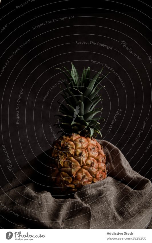 Sweet ripe pineapple in dark studio fruit fresh natural tropical exotic whole food nutrition vitamin raw ingredient diet vegan delicious healthy organic sweet