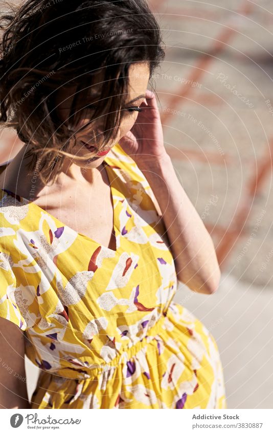 Thoughtful young tanned woman standing on the street dreamy rest staircase allure summer style fashion chill relax female slim skinny thoughtful trendy carefree