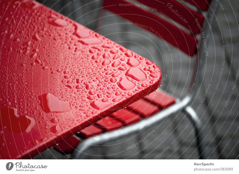 After the rain Chair Table Restaurant Town Cold Wet Gray Red Café Sidewalk café Drops of water Water puddle Tabletop Colour photo Exterior shot