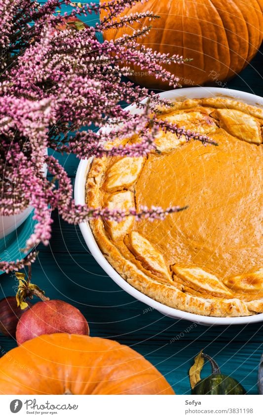 Autumn thanksgiving background with pumpkin pie autumn table sweet cake dinner wood rustic card celebration composition concept orange bake halloween dessert