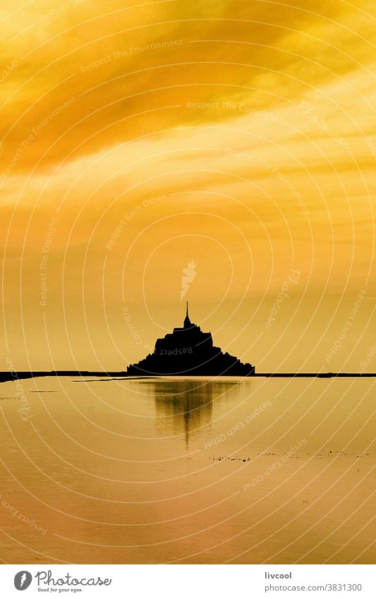 golden sunrise on mount st michael, normandy light abbey mont saint michel yellow background church hill place famous place tourist place cloudy pink sunset