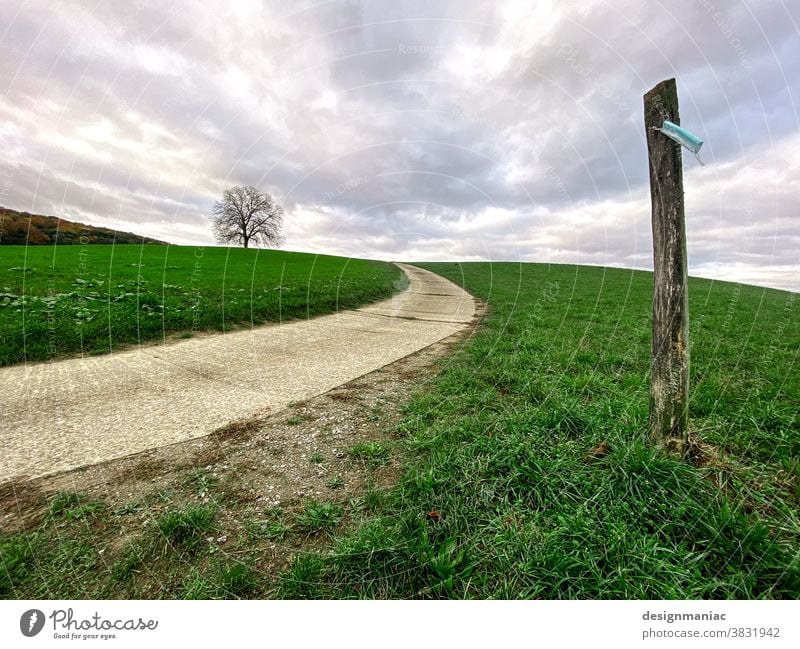 Where's the trip going? Lanes & trails Mask Tree stake Flag Clouds Hill Sky Landscape off Green Gray Wayside Horizon tranquillity Gale cloudy Grass Meadow