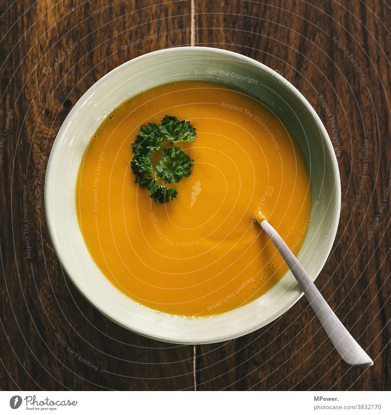 pumpkin soup Soup Pumpkin Pumpkin soup Bowl Spoon Table Parsley Eating Orange-red Delicious Healthy Eating Vegetarian diet Vegetable Autumn Diet