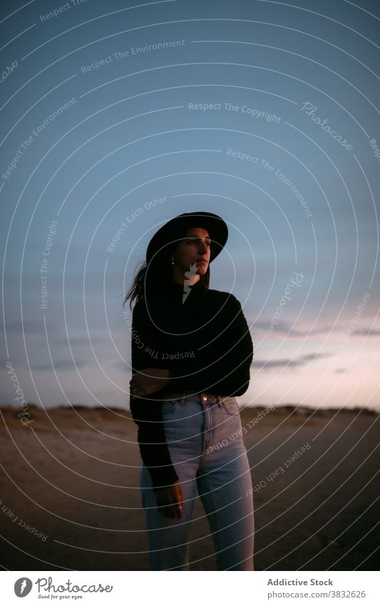 Dreamy woman in meadow at sunset thoughtful contemplate nature sky dreamy style dawn female think calm field idyllic solitude romantic landscape lady beautiful