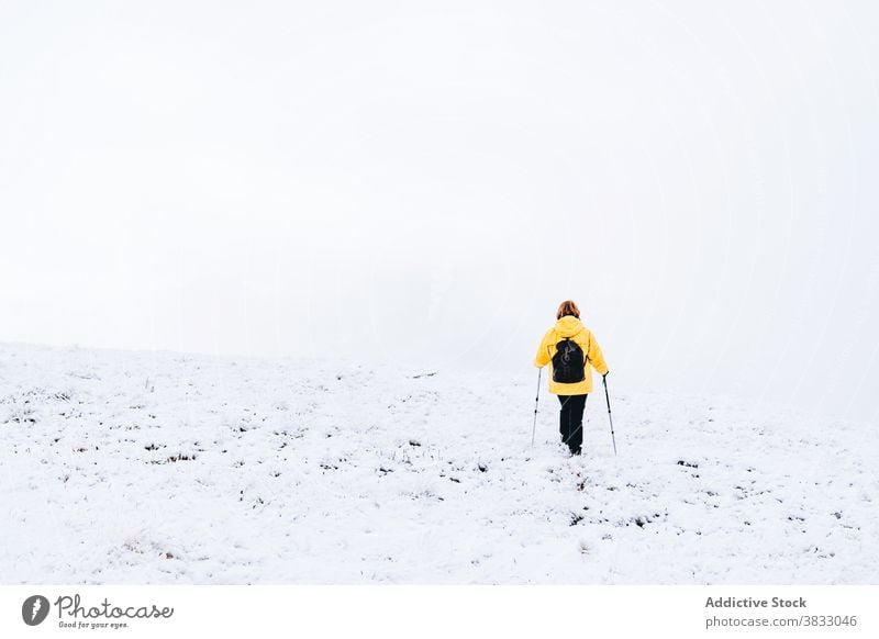 Unrecognizable traveler in mountains in winter snow trekking hike pole nature highland mountaineer pyrenees mountains andorra hiker adventure landscape explore