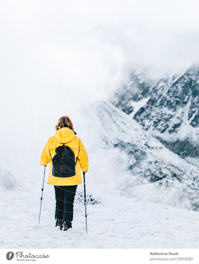 Unrecognizable traveler in mountains in winter snow trekking hike pole nature highland mountaineer pyrenees mountains andorra hiker adventure landscape explore