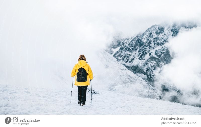 Unrecognizable traveler in mountains in winter snow trekking hike pole nature highland mountaineer pyrenees mountains andorra hiker adventure landscape explore