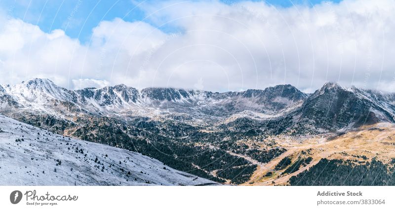 Rocky mountain ridge covered with snow rock range rough slope peak cloud panorama cold majestic scenery rocky pyrenees el pas de la casa andorra envalira nature