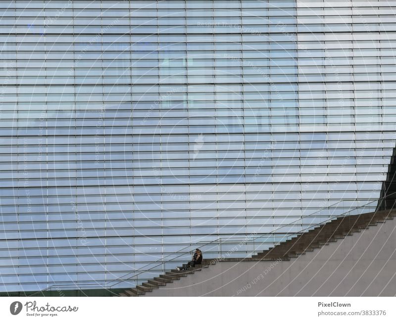 Lonely person on a staircase Loneliness Stairs Concrete Architecture Wall (building) Manmade structures Exterior shot Banister Blue, urban, Berlin