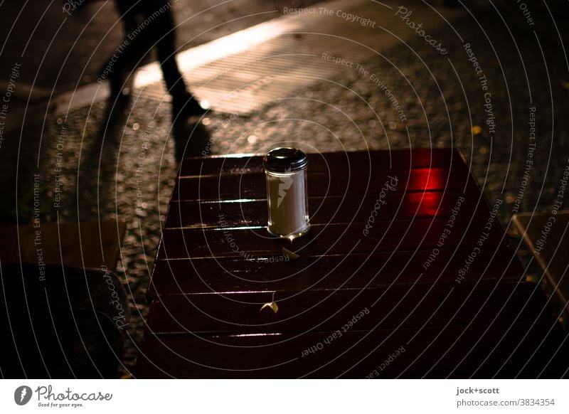 Pedestrians against the light Back-light Headlamp Human being Wooden table Sugar bowl Silhouette Going Pedestrian crossing blurriness Dark Legs evening mood