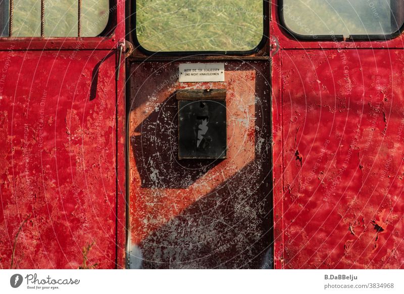 "Please close the door and do not lean out". The discarded old gondola now stands on a mountain meadow in the Alps. Gondola Cable car Mountain Exterior shot