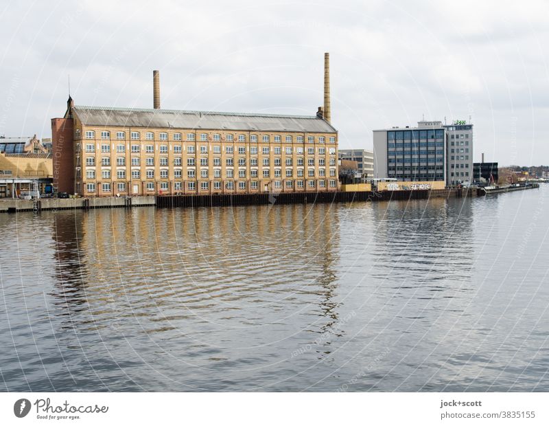 An old factory in the mirror of time Spree Architecture Chimney Building Factory köpenick Reflection Sky Clouds River bank Surface of water Industrial site