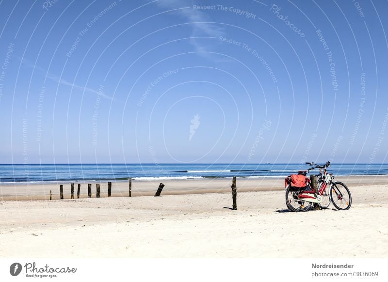 Two bicycles on the beach of the Baltic Sea Bicycle Activity holiday Beach activity Ocean duene Marram grass Water Waves Sun North Sea sunshine Wheel