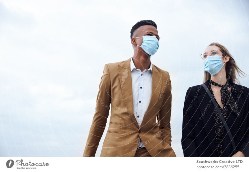 Business Couple Wearing Masks Outside Airport For Business Trip With Luggage During Health Pandemic business businessman businesswoman face mask face covering