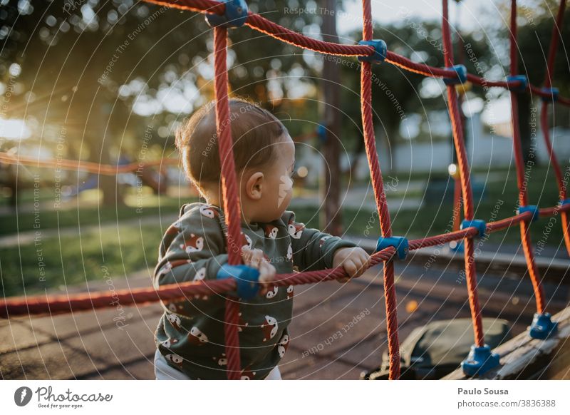 Toddler playing on the playground Caucasian 0 - 12 months Colour photo one person Baby Human being Day Small Cute Infancy Child Beautiful Happy Playing