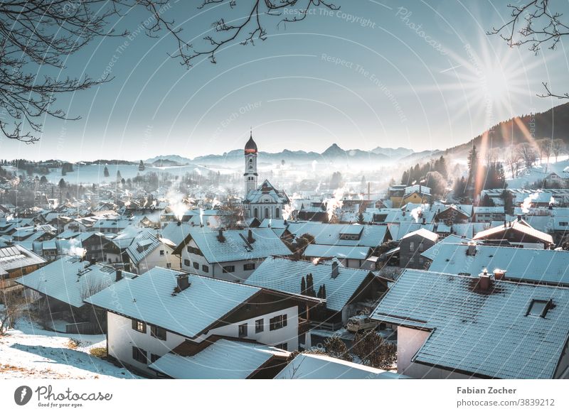 Winter morning over a mountain village Bavaria mountains Germany Europe Church Landscape photographs Nature nettle-cracking Winter 2020 Allgäu Sunrise Skyline