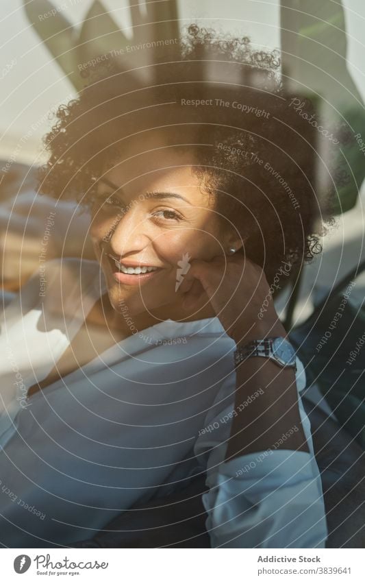 Content black woman relaxing in armchair tender serene peaceful charming calm harmony home female ethnic african american rest comfort style lean cozy