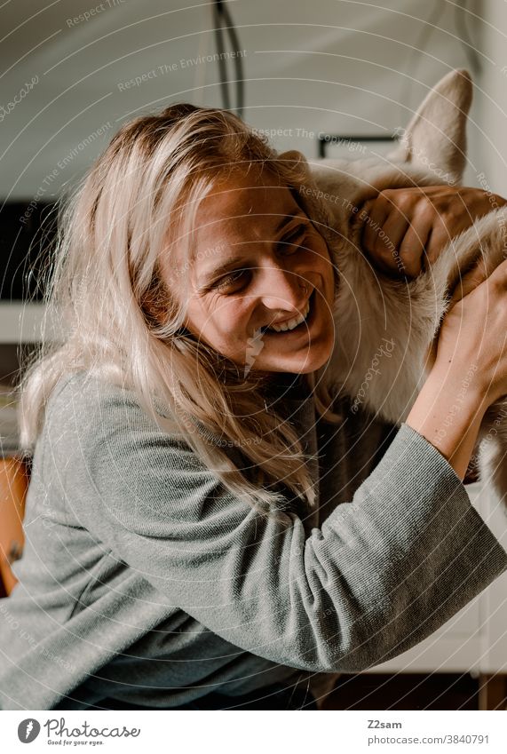 Young woman playing with her dog Dog Shepherd dog White Affection Love Pet Cuddling Caress Playing Friendship Together Happy Colour photo Animal Cute Embrace